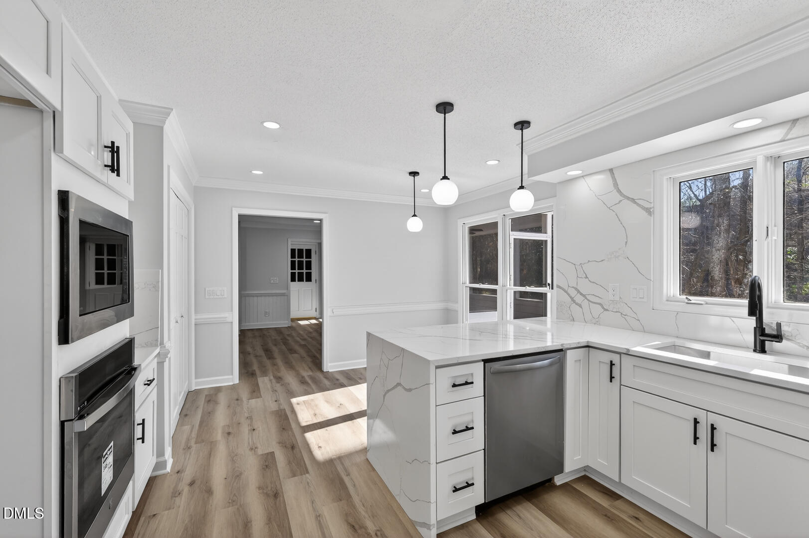 2224 Effingham Circle Raleigh, NC 27615 - Photo 10 of 51 a kitchen with a sink stove and cabinets