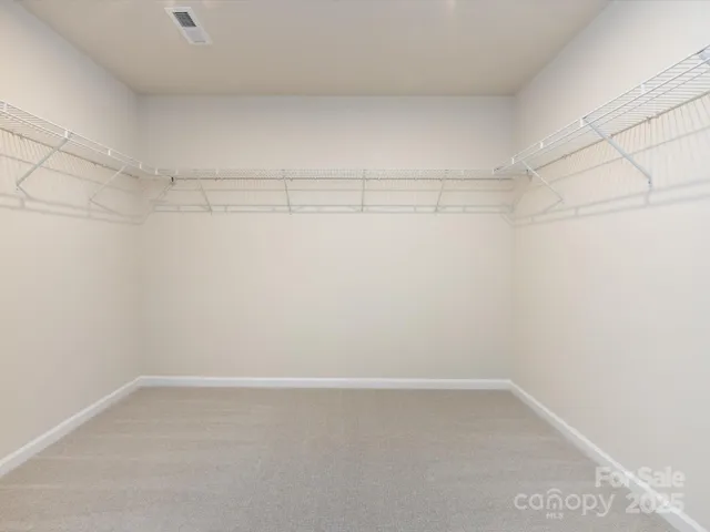 a view of a room with racks on the wall