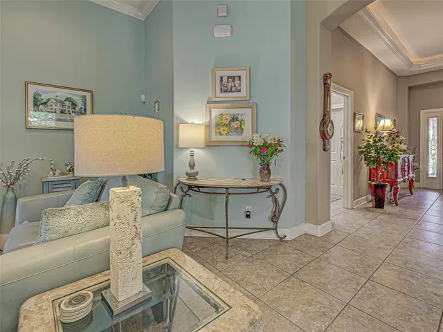 a kitchen with stainless steel appliances granite countertop a stove top oven a sink a dining table and chairs