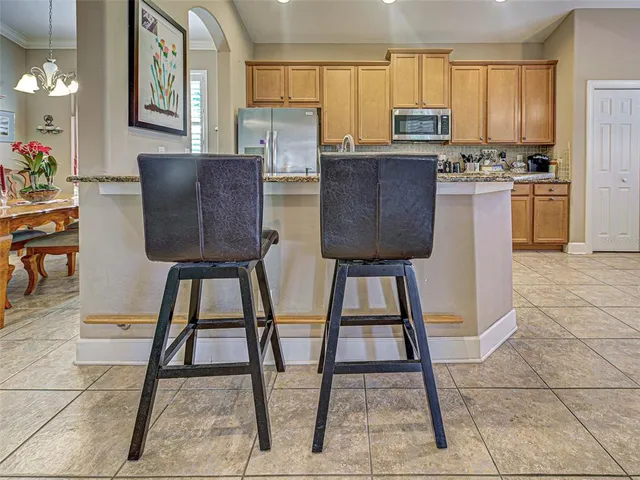 a view of a workspace with furniture and wooden floor