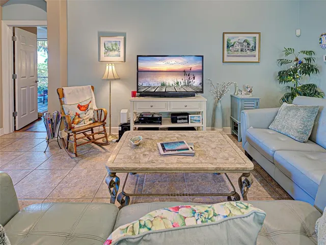 a bathroom with a granite countertop sink a toilet a mirror a bathtub and shower