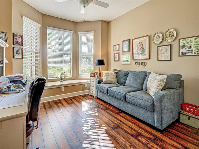a bedroom with furniture and flat screen tv