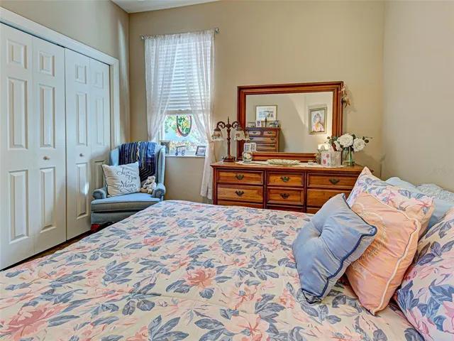 a living room with furniture a rug and a large window