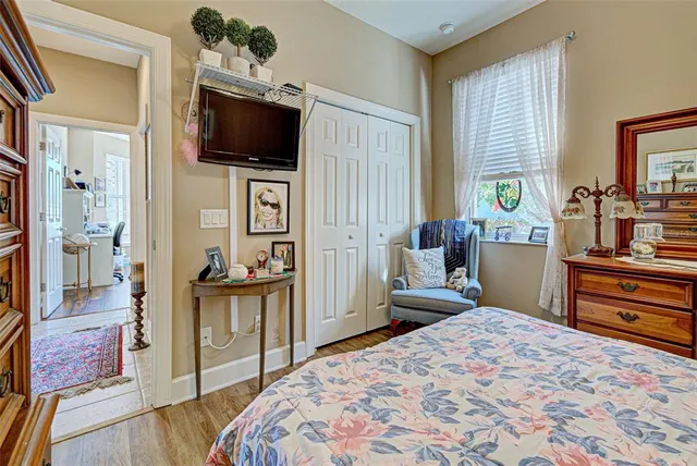 a view of a house with backyard porch and sitting area