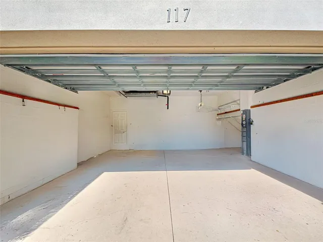 a bed room with a bed and a chandelier