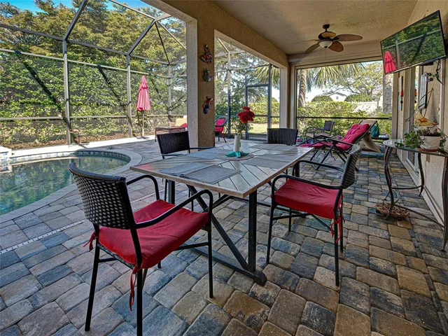a bathroom with a granite countertop sink mirror and bathtub