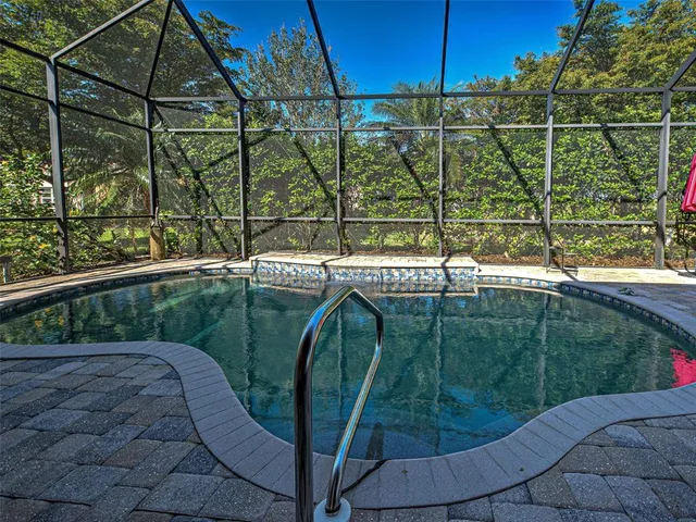 a bathroom with a shower sink and mirror