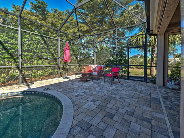 a bathroom with a shower sink and mirror