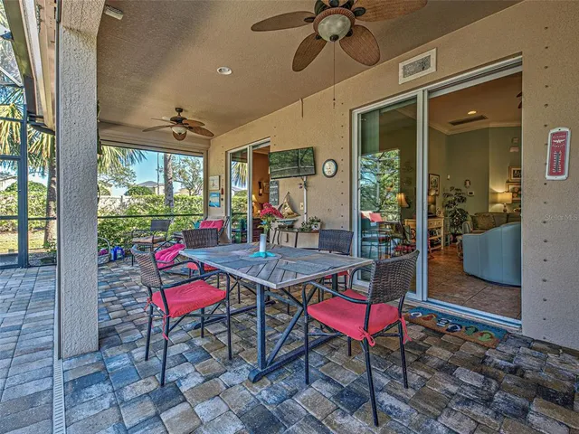 a view of a swimming pool with an outdoor space and seating area