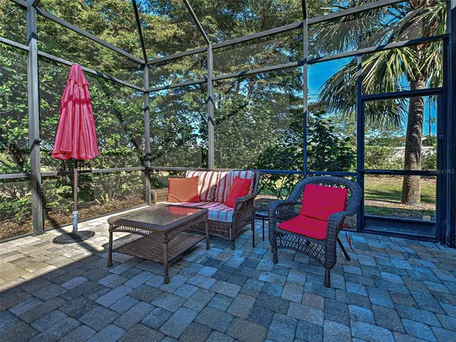 a view of a swimming pool with outdoor seating