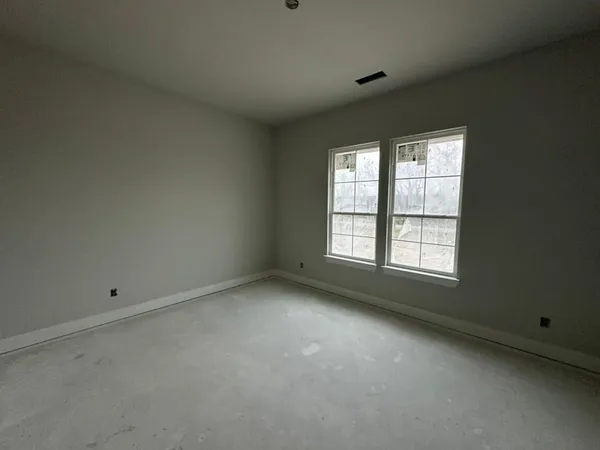 a kitchen with stainless steel appliances a refrigerator and a stove top oven
