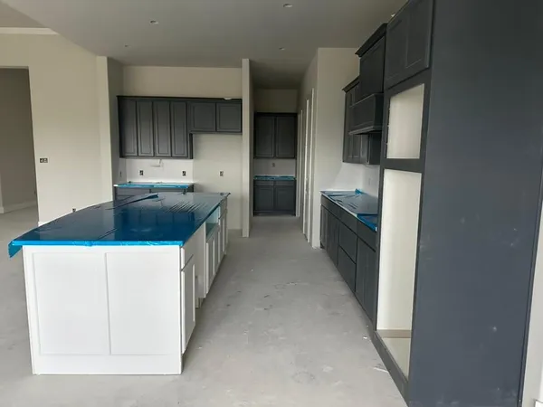a kitchen with a cabinets and window