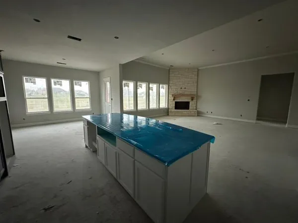 a view of a kitchen with refrigerator and microwave