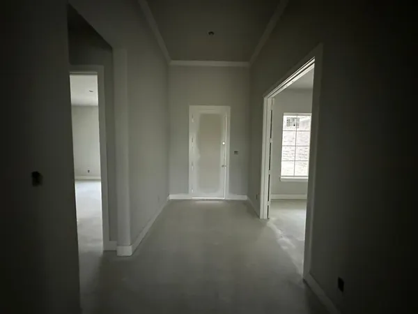 an empty room with a empty space and windows