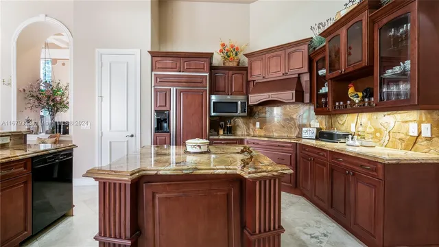 a view of a dining room with furniture a chandelier and a chandelier