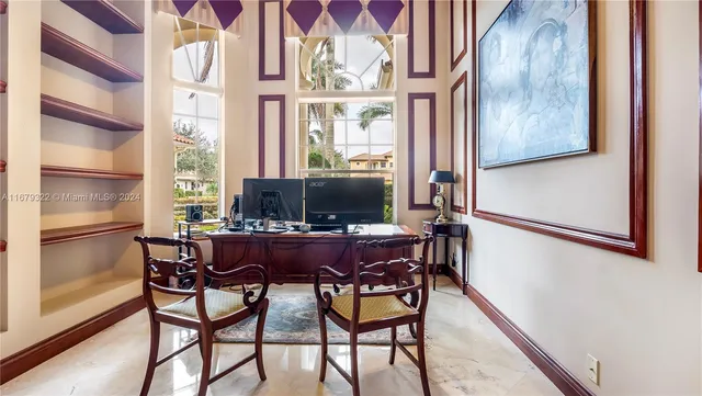 a view of a house with a yard and potted plants