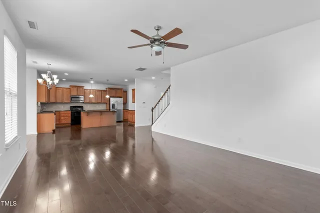 a view of a kitchen with a sink and microwave