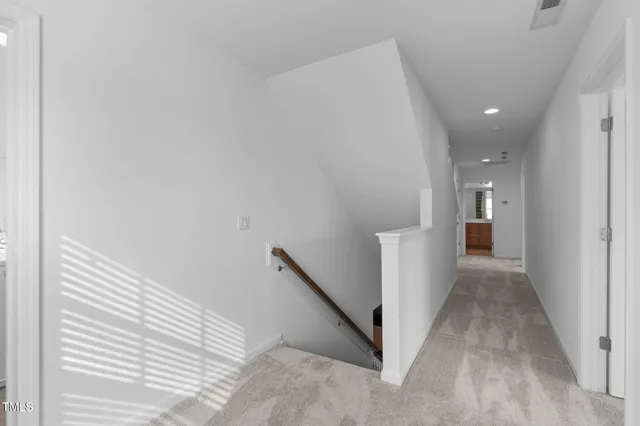 a view of a hallway with an entryway