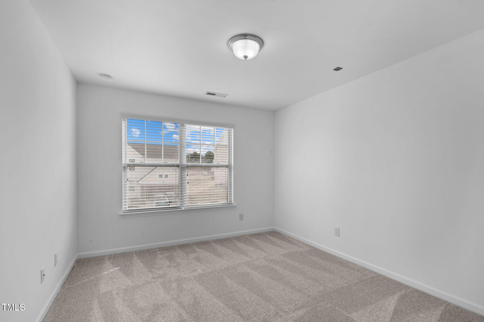 4139 Davis Meadow Street Raleigh, NC 27616 - Photo 22 of 43 an empty room with windows