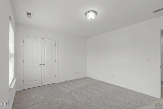 an empty room with a natural light