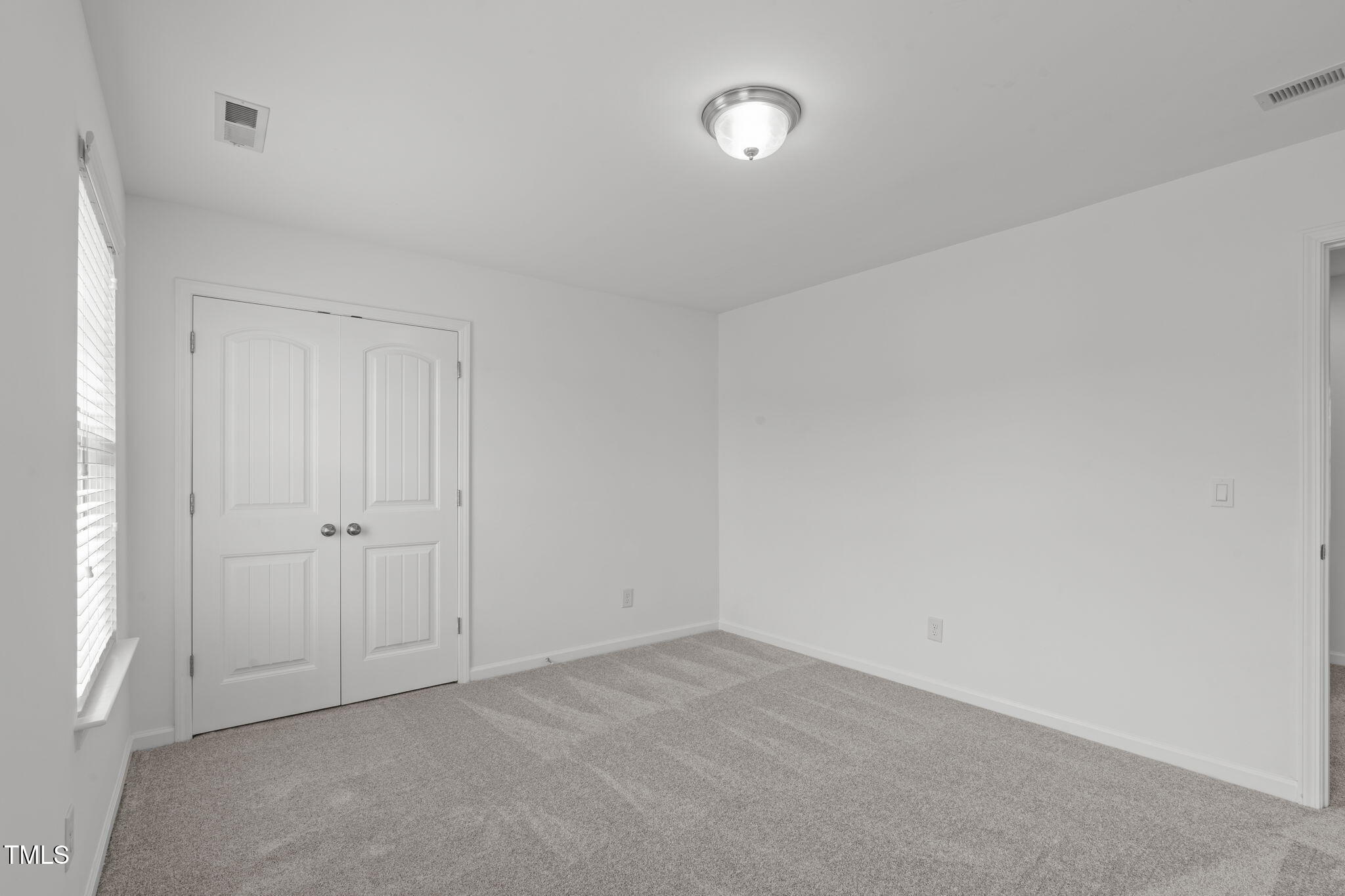4139 Davis Meadow Street Raleigh, NC 27616 - Photo 26 of 43 an empty room with a natural light