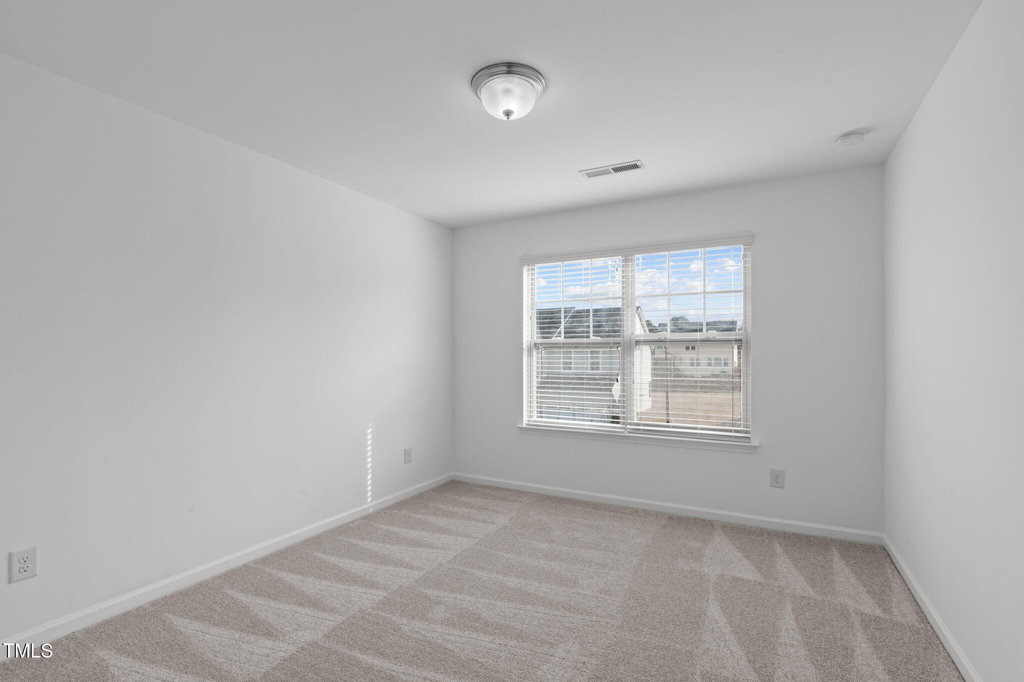 4139 Davis Meadow Street Raleigh, NC 27616 - Photo 27 of 43 an empty room with a window