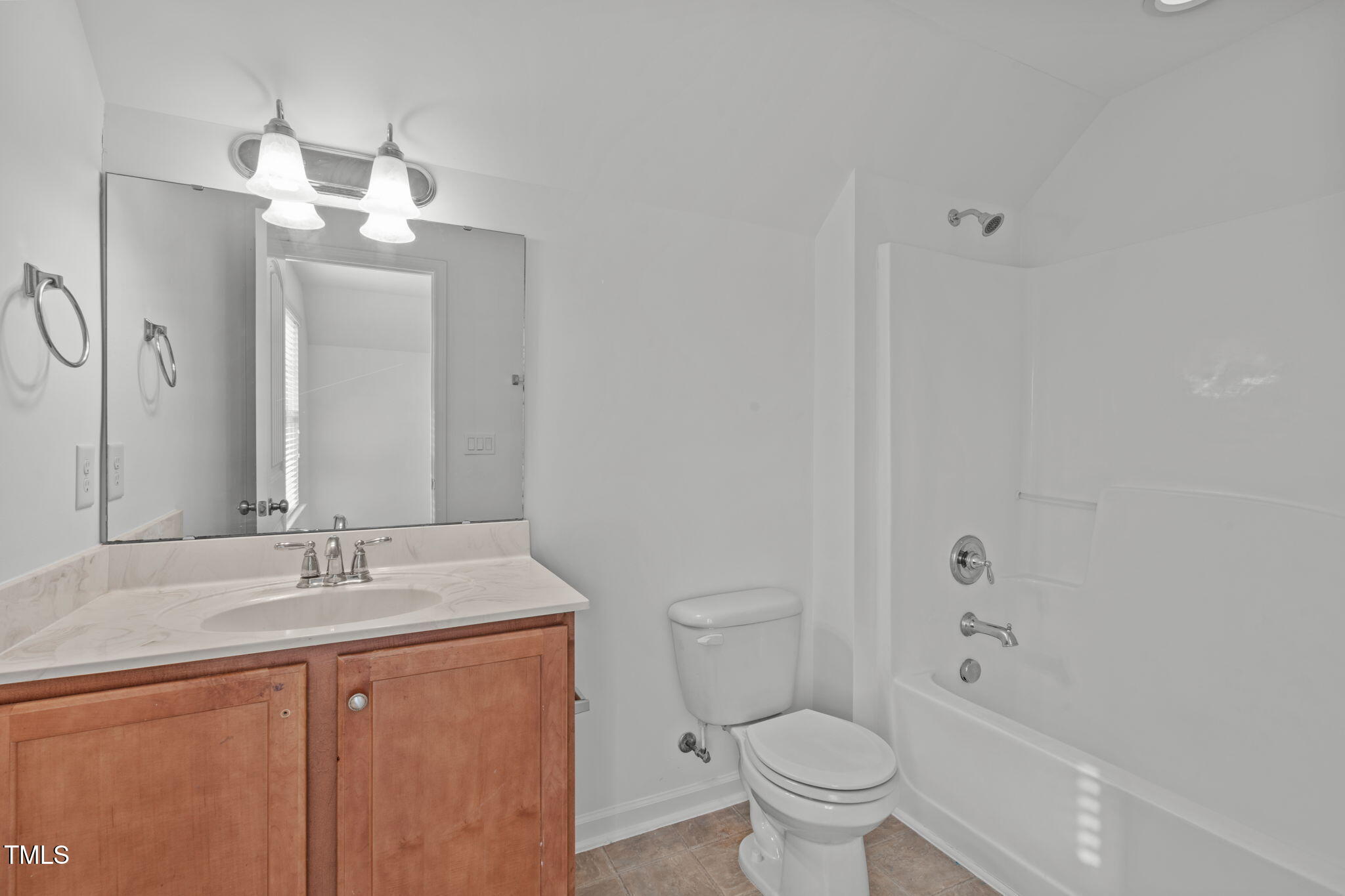 4139 Davis Meadow Street Raleigh, NC 27616 - Photo 38 of 43 a bathroom with a granite countertop sink a toilet and a mirror