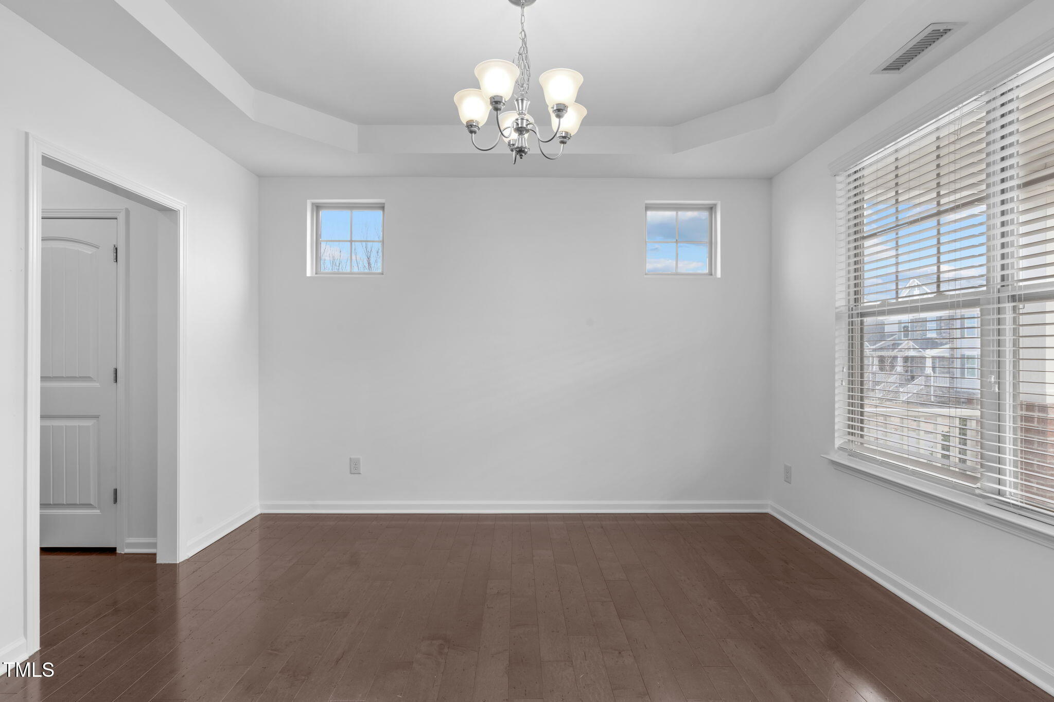 4139 Davis Meadow Street Raleigh, NC 27616 - Photo 6 of 43 wooden floor in an empty room with a window