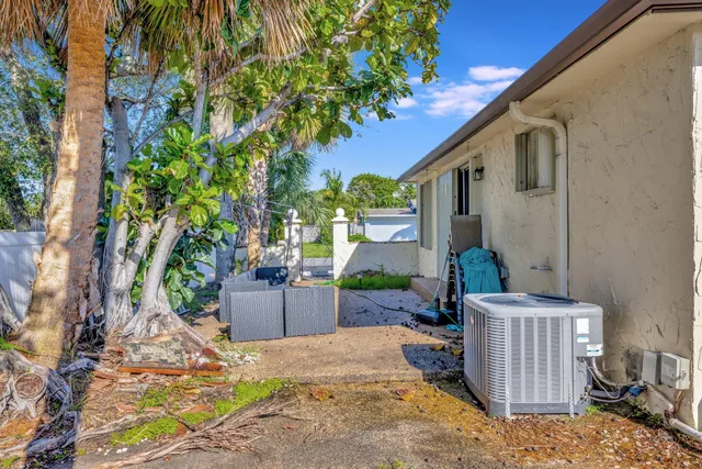 a backyard of a house with seating space