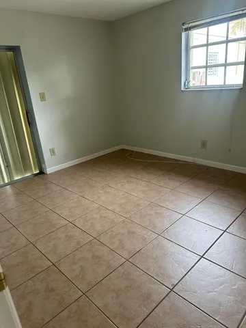 a white toilet sitting next to a shower curtain