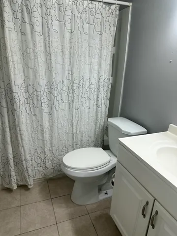 a kitchen with a refrigerator and a sink