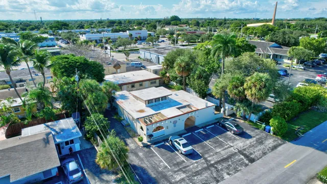 an aerial view of a house with a yard basket ball court and outdoor seating
