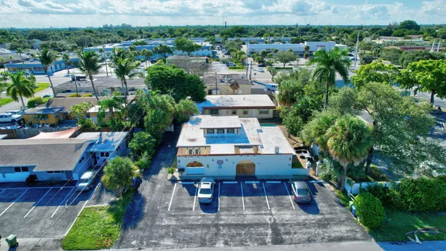 an aerial view of multiple houses with yard