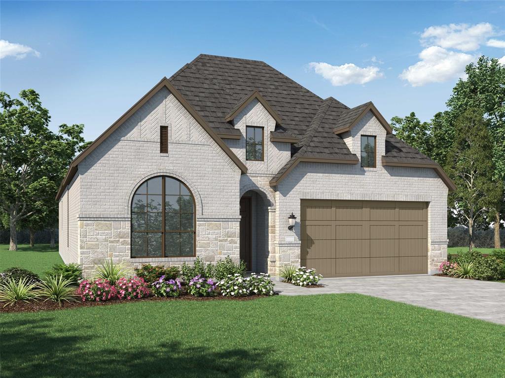 1228 Emilia Road Fate, TX 75087 - Photo 1 of 1 a front view of a house with a garden