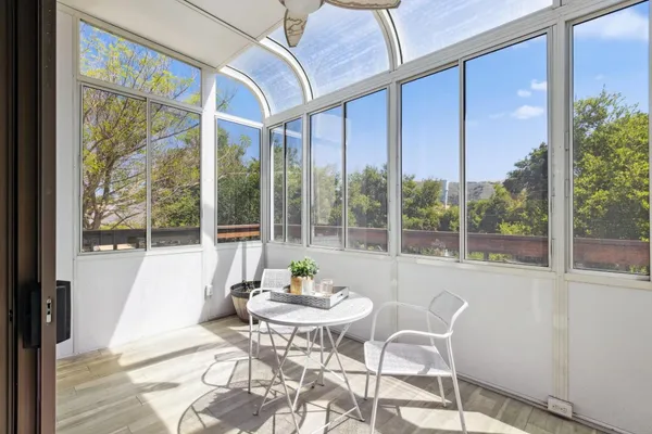 a dining room with furniture window and outside view