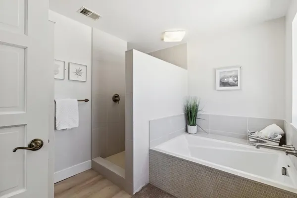 a bathroom with a granite countertop sink a toilet and a mirror