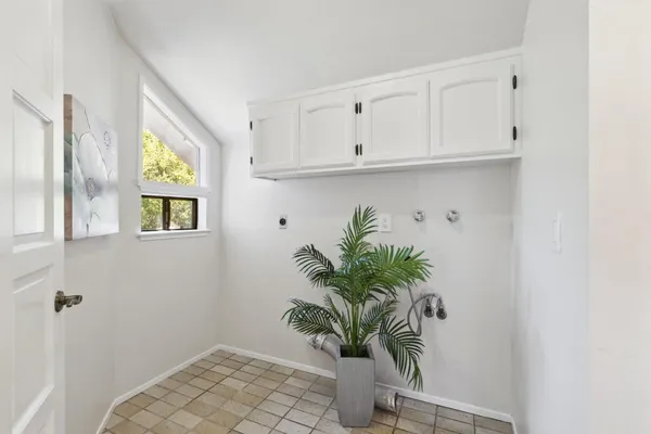 a bathroom with a granite countertop sink mirror vanity and toilet
