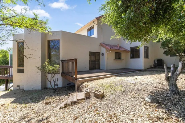 a view of a balcony with furniture