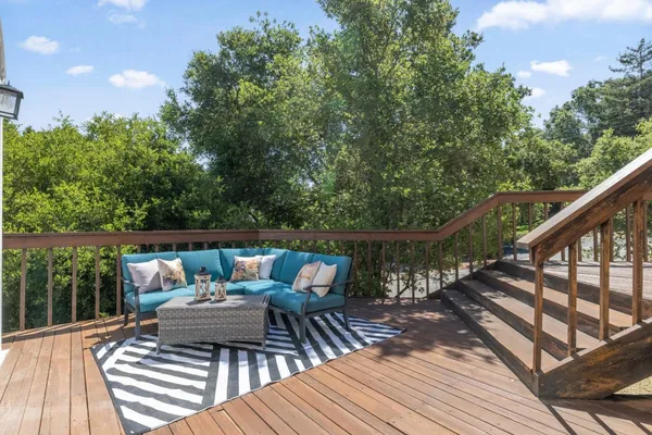 a balcony view with a seating space