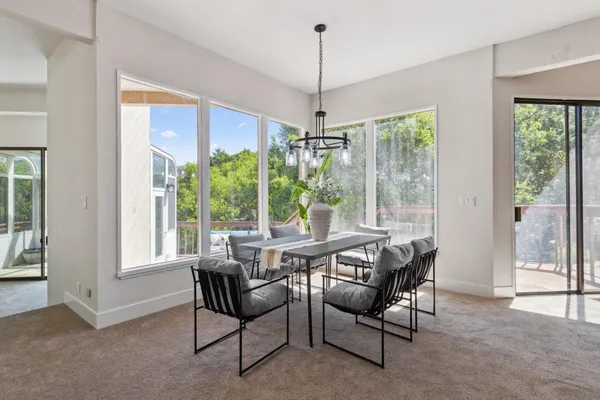 a view of a dining room with furniture window and outside view