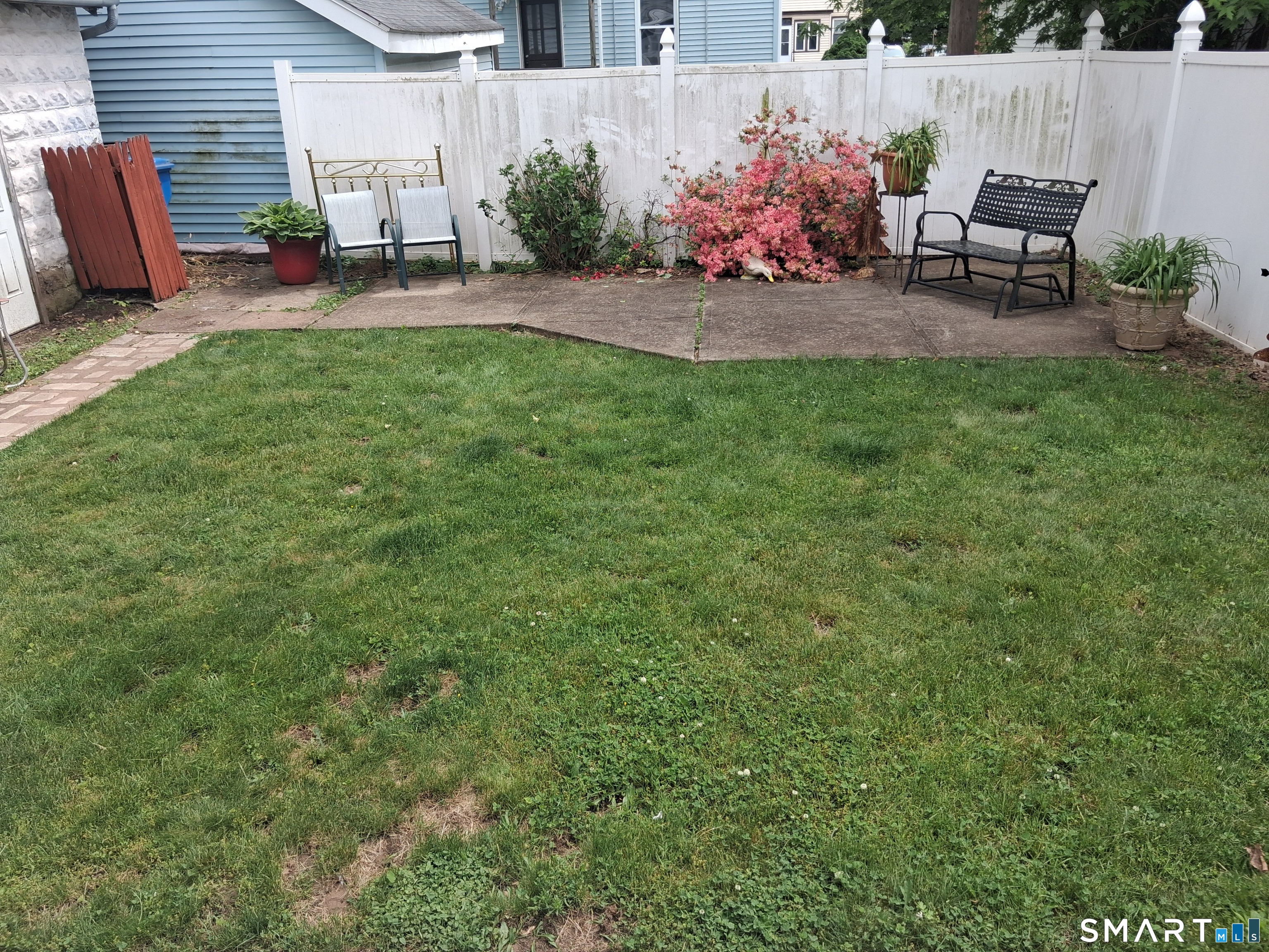 26 4th Street Hamden, CT 06514 - Photo 19 of 40 a view of a backyard with sitting area