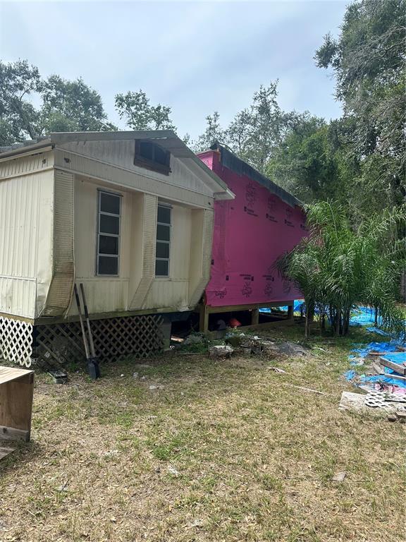 12232 Southwest 44th Drive Webster, FL 33597 - Photo 15 of 28 a house view with a backyard space