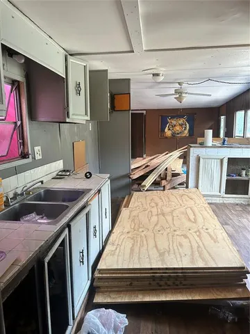 a bed sitting in a room next to a window