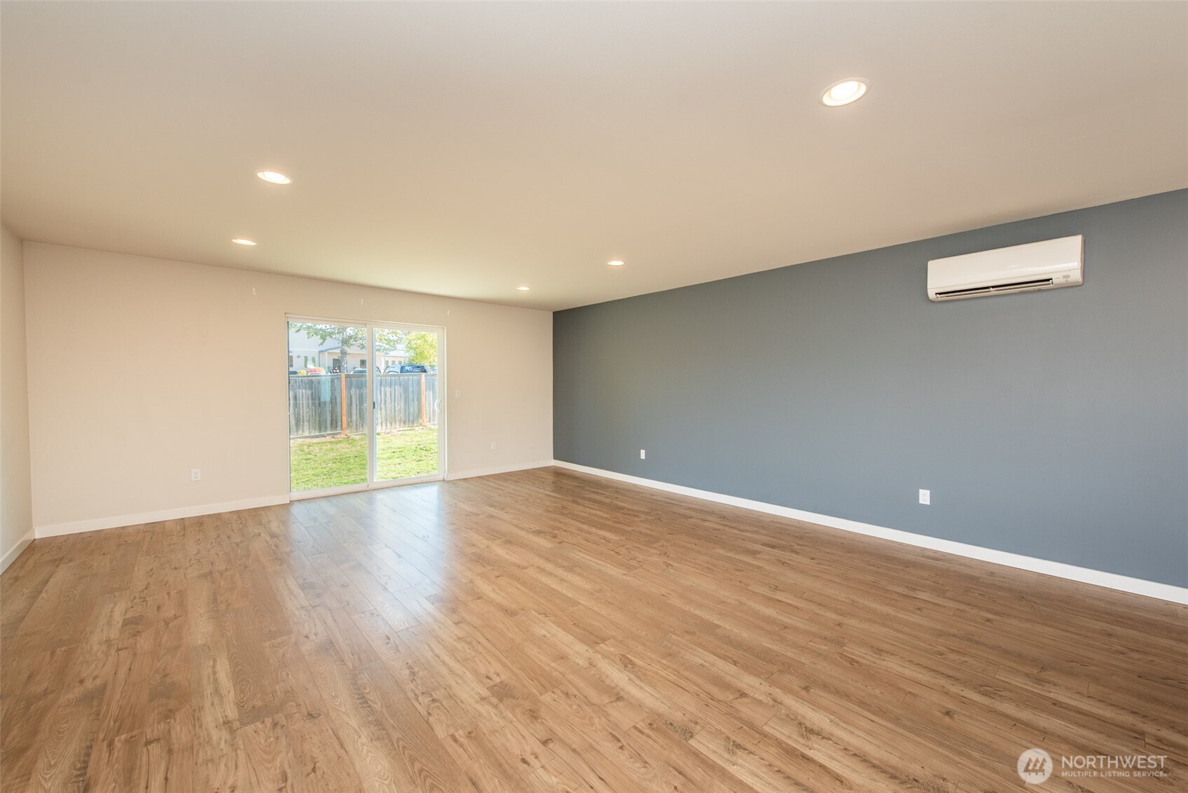 3601 Page Street Port Angeles, WA 98362 - Photo 16 of 35 a view of an empty room with wooden floor and a window
