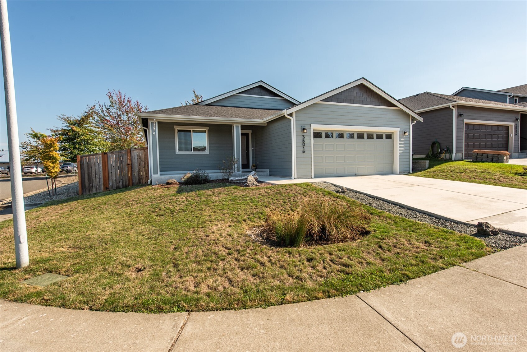 3601 Page Street Port Angeles, WA 98362 - Photo 3 of 35 a front view of a house with a yard and garage