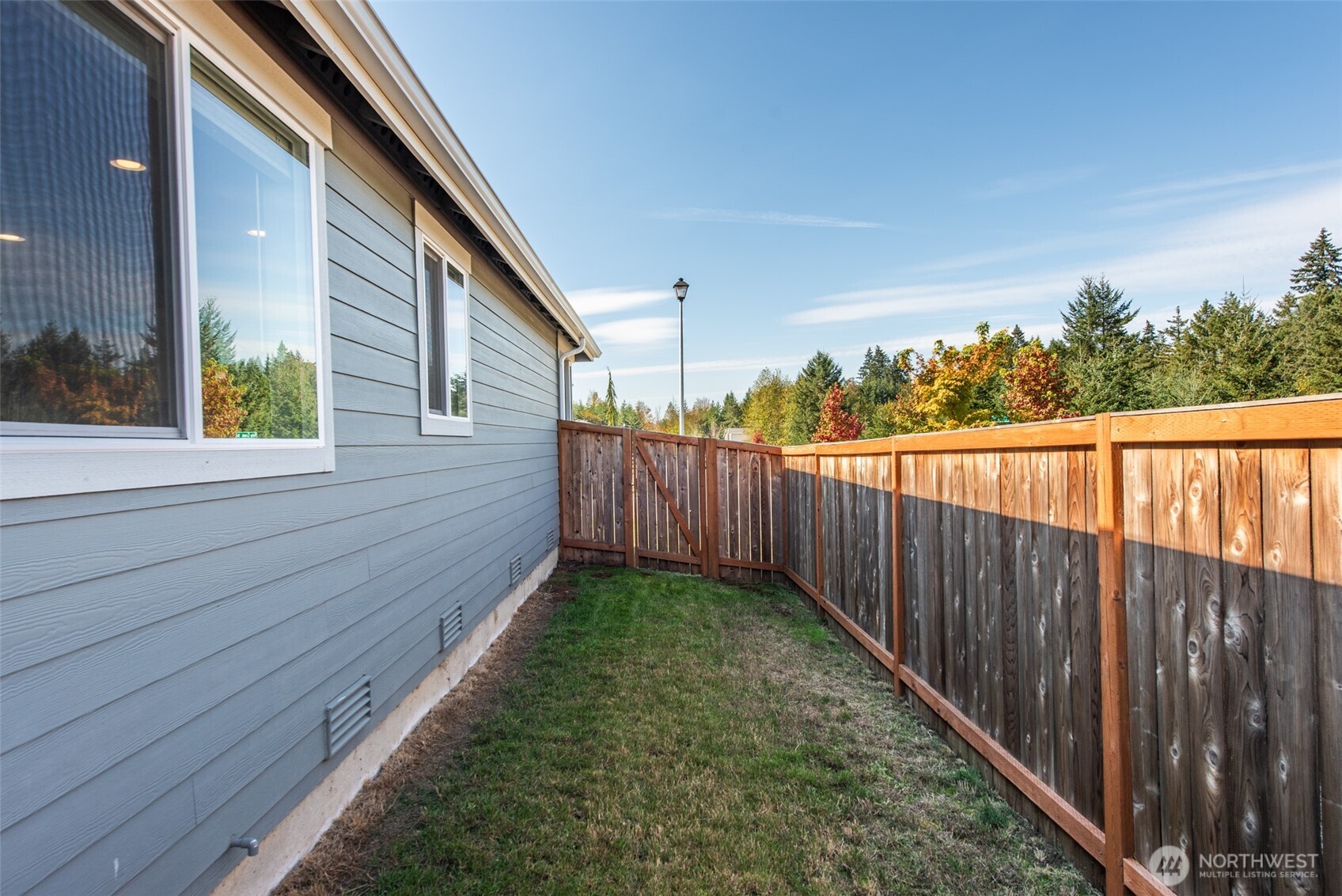 3601 Page Street Port Angeles, WA 98362 - Photo 33 of 35 a view of a backyard with wooden fence