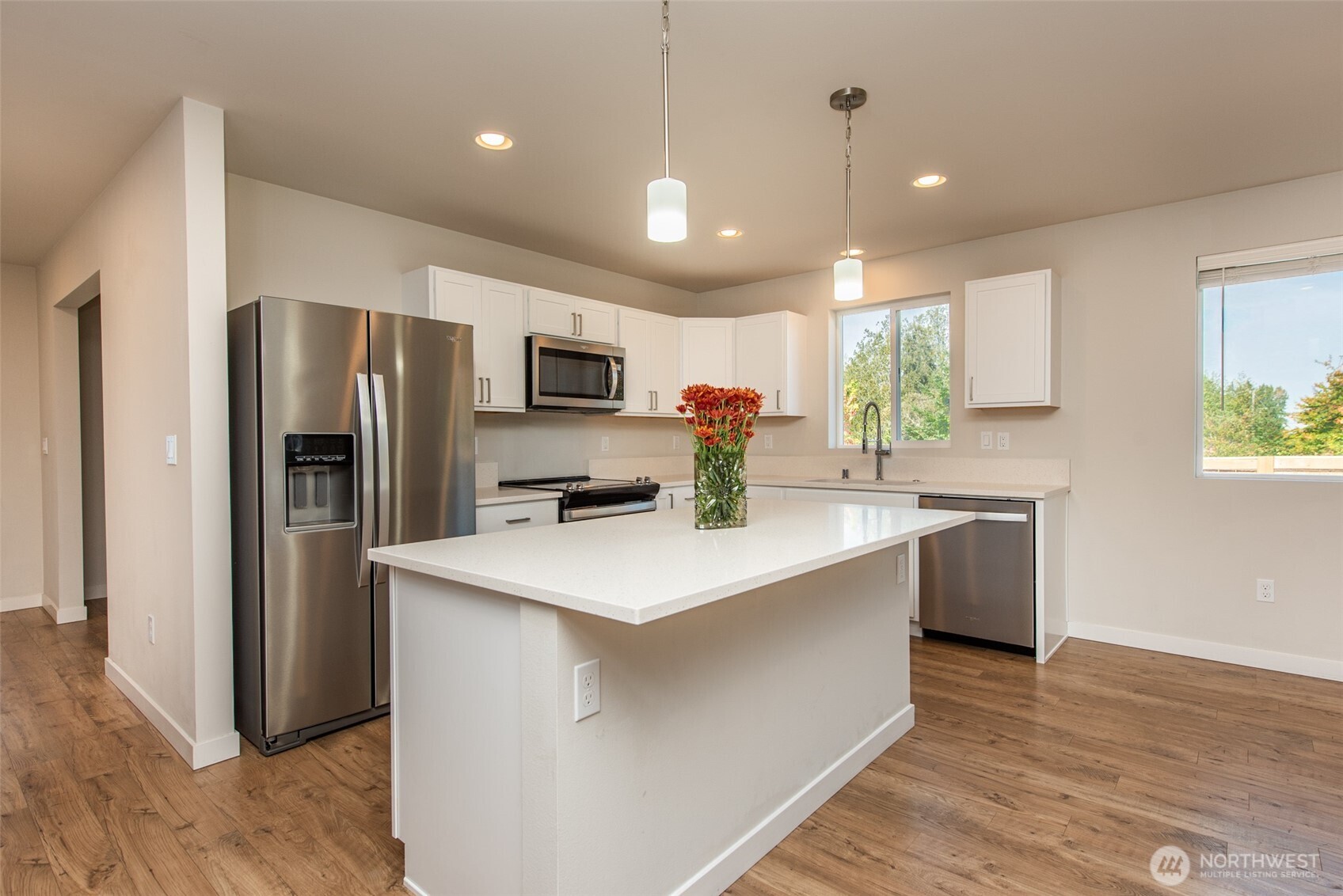 3601 Page Street Port Angeles, WA 98362 - Photo 7 of 35 a kitchen with kitchen island a refrigerator sink and microwave