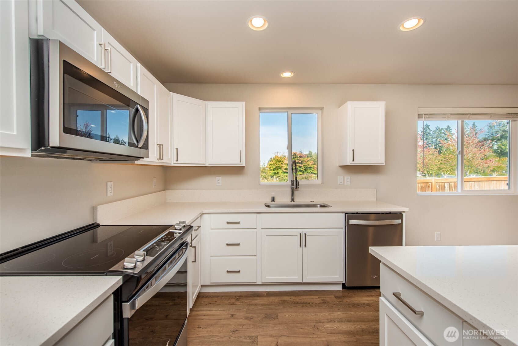 3601 Page Street Port Angeles, WA 98362 - Photo 8 of 35 a kitchen that has a sink and a stove in it
