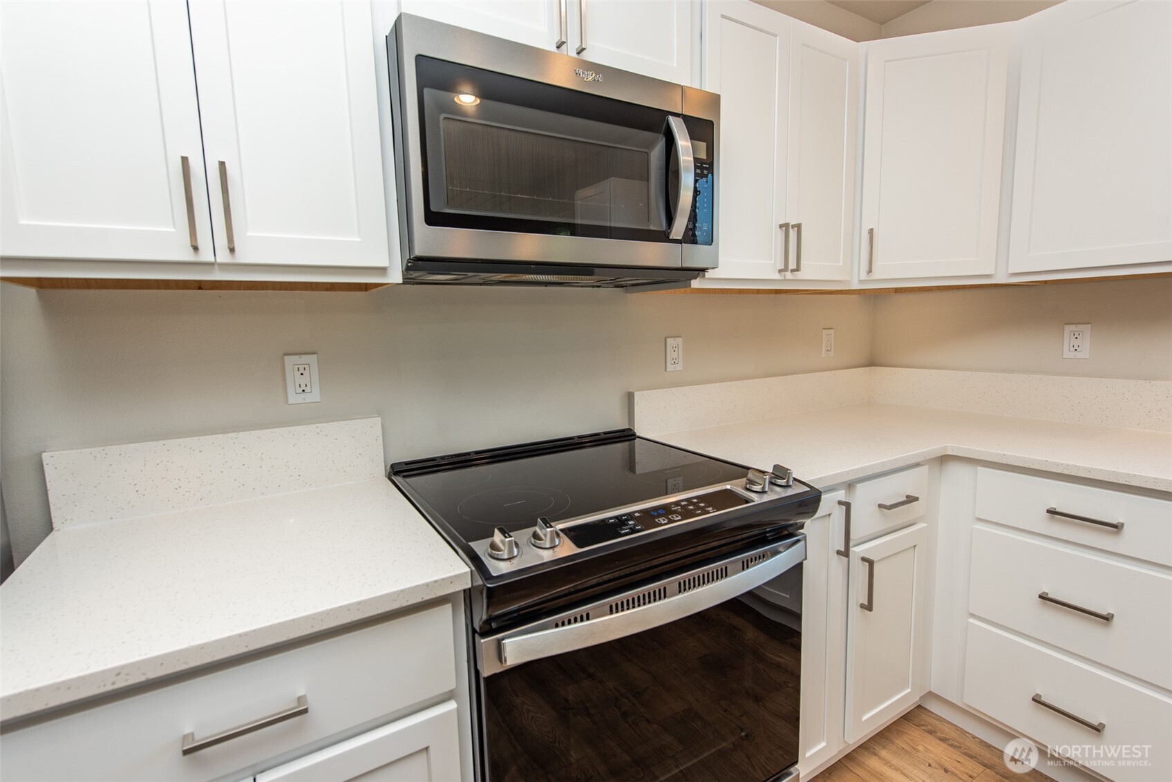 3601 Page Street Port Angeles, WA 98362 - Photo 9 of 35 a kitchen with white cabinets and black appliances