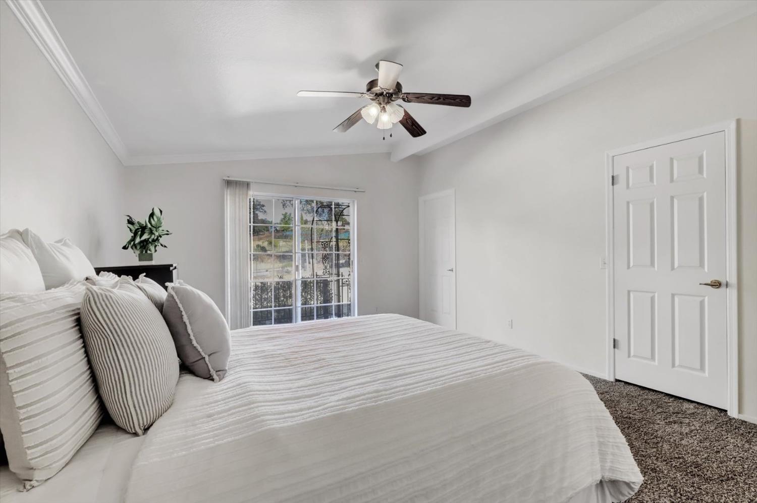 16260 Hillaire Road Rough and Ready, CA 95975 - Photo 11 of 45 a bedroom with a large bed and a window
